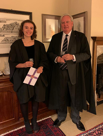 Winner, Alice Mee, receiving her prize from the Master, Sir Christopher Greenwood