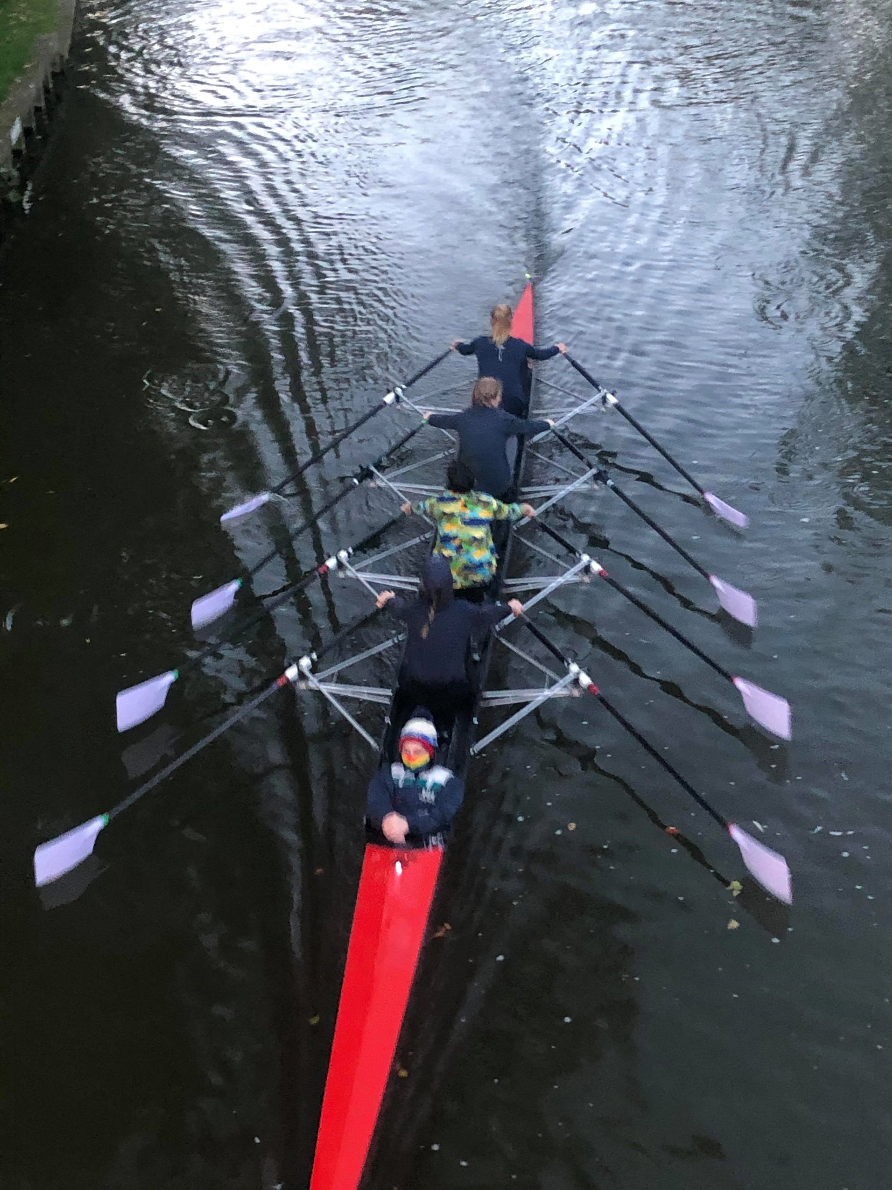 SFR rigged as a coxed quadruple scull, finely displaying the new lavender blades