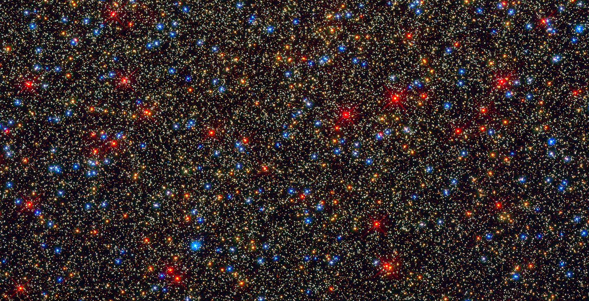 The Omega Centauri globular star cluster. The sharp vision of the Hubble Space Telescope can distinguish brilliant star from star even in very crowded regions like this, revealing that stars are very diverse in size, mass, colour, age, and composition. Image Credit: NASA/ESA