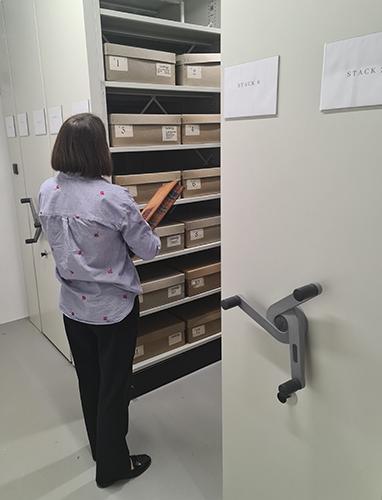 Archivist looking through the archives