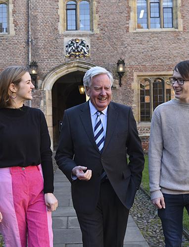 The Master and students walking through First Court