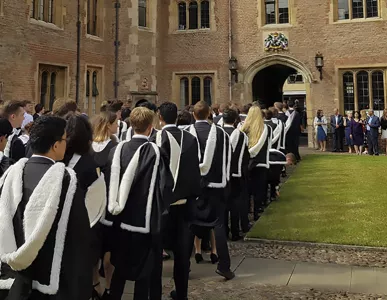 MA Day students lining up in First Court ready to graduate.