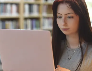 student studying on their laptop