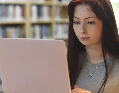 student studying on their laptop